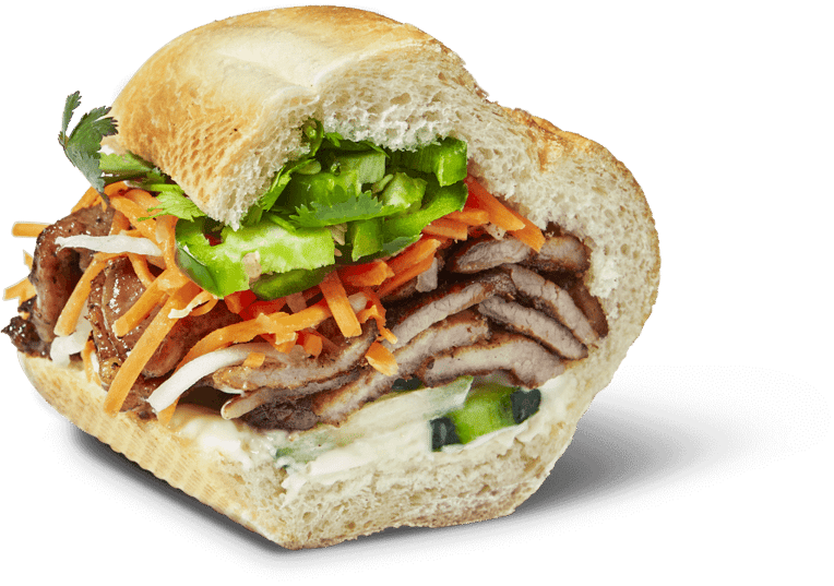 Bun Mee bánh mì sandwich filled with sliced meat, pickled vegetables and herbs