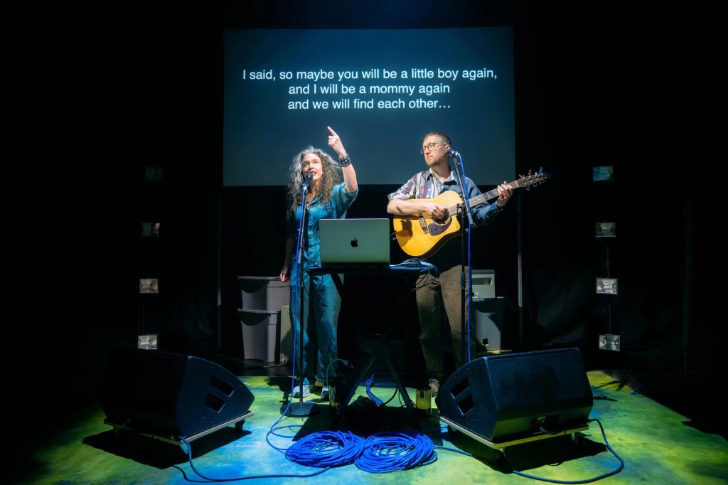 Abigail Bengson singing alongside Shaun Bengson playing guitar in Ohio
